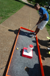Sophomore Joel Polk putts for a cure in a benefit for St. Judes during Up 'Til Dawn. - Photo by Jonathan Blair