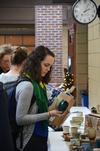 12/7/12 - Rebecca Blevins, junior biology major, admires a cup on sale in the Student Union Building during the annual Christmas pottery sale. - Zac Calvert
