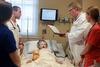 Tim Smith, dean of the school of nursing, talks to a group of students in the simulation lab. - Photo by Kristi McMurry