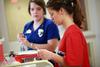 10/4/12 - Nursing students prepare tools for a simulation lab session. - Kristi McMurry