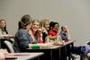 Shelby Henson, junior family studies major, talks with Emily Russell, sophomore psychology major, before the first senate meeting of the semester. - Photo by Matt McDaniel