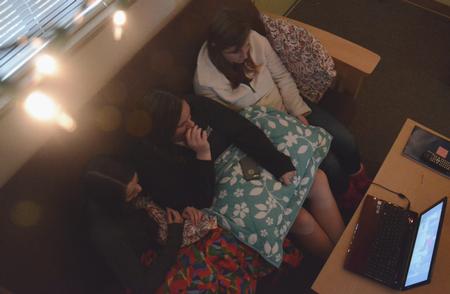 Ryan Edenfield, Kensie Zills and Lydia Dahl camp out in their dorm to watch movies and to avoid a stomach virus outbreak.
