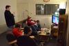 Roommates watch television together with friends in the living room of their dorm in Heritage. - Photo by Jacob Moore