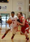 Freshman Bulldog Roy Bullock drives against Christian Brothers' Dominic Fragale during a home game. - Photo by Jacob Moore