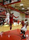 Bulldog Corieon Pearson goes up for a shot against Christian Brothers' Drew Hildreth during a home game. Union narrowly won 73-70. - Photo by Jacob Moore