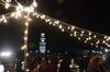 Guests of the Homecoming Winter Wonderland mingle under the string lights as they enjoy hot chocolate, ice skating and fellowship with each other.  - Photo by Olivia Wallace