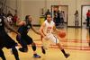 Pedro Faller dribbles past a Hawks defender for a lay up.  - Photo by Matt McDaniel