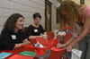 Juniors Ashley Mitchell and Jodie Curtis help incoming freshmen sign in during The Spring Thing Weekend. - Photo by Jonathan Blair