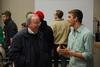 David S. Dockery, president of the university, talks and laughs with freshman Jesse Dahms prior to Student Senate. - Photo by Anne Richoux