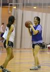 Alejandra Vargas, junior accounting major, looks for a pass during an intramural basketball game held at West Jackson Baptist Church. - Photo by Jacob Moore