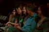 Guests laugh as guest artist Doug Berky performs in the W.D. Powell Theatre.  - Photo by Anne Richoux
