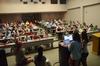Anna Goodman, freshman broadcast journalism major, and Savannah Hari, junior sports medicine major, take role at the Senate meeting to make sure the representatives from the organizations are in attendance. - Photo by Matt McDaniel