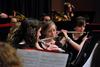 Quinlan Draper, freshman psychology major, plays in the symphonic band concert in the chapel.  - Photo by Anne Richoux