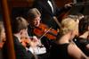 Mark Bolyard, professor of biology and department chair, plays viola at the orchestra recital at First Baptist Church. - Photo by Matt McDaniel