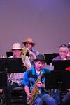 Blake Giles (center), junior music major, performs during the jazz band concert.  - Photo by Anne Richoux