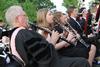 David McClune, university professor of music, plays with the Symphonic Band at the start of Spring Graduation. - Photo by Matt McDaniel
