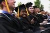 Liane Gozmao, biology and psychology double major, smiles before receiving her diploma at Spring Graduation. - Photo by Matt McDaniel