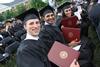 Photo by Matt McDaniel

Jake Ryan and Diego Sales Santos, business administration graduates, and Claudia Velasco, accounting graduate, hold their diplomas after receiving them during Spring Graduation on the Great Lawn. - Photo by Matt McDaniel