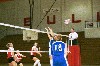 09/250/02 - No. 8 Jennie Glassey (junior from Carlsbad, CA) goes for the kill.  Andrea Darr and Allison Shein look on.