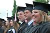 Music graduates Chelsea Jones, Jeremy Isbell and Greg Hines wait to receive their diplomas at Spring Graduation on the Great Lawn.  - Photo by Anne Richoux