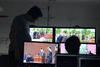 Information Technology staff operate live streaming equipment at Spring Graduation. This was the first year that graduation was streamed for viewers to watch from home. - Photo by Jacob Moore