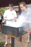 Freshmen Landon Preston and Ryan Hill work the grill at an SGA cookout. - Photo by Kristen Nicole Sayres