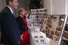 Music professors David Dennis and Diane Gatwood look over a photo display of Dr. Joe Blass' time at Union during a retirement reception in his honor. - Photo by Kristen Nicole Sayres