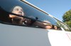 Senior Melinda Eckley, journalism major, stares out the Union van as spectators watch her and fellow participants compete for being the last to survive and win. - Photo by Jonathan Blair