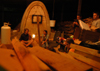 Art students hold the first firing of their homemade
wood burning kiln. - Photo by Lindsay Stavish