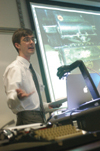 Senior Allen Smith, computer science & mathematics major, presents "Letting Your Fingers Do Too Much Walking: The Distance Traveled While Typing," a paper on the benefits of the Dvorak keyboard during the university's first scholarship symposium. - Photo by Lindsay Stavish