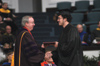 President David S. Dockery presents Art Wong with his degree during fall graduation. - Photo by Jim Veneman