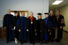08/7/04 - James Patterson, Carla Sanderson, Tom Rosebrough, David S. Dockery, Judy Fletcher, Donna Sachse, Kelvin Moore, and Keith Absher pose in their regalia shortly before summer graduation.