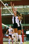 09/252/02 - Jennie Glassey (left) and Andrea Darr (right) go for the block