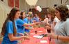 08/227/14 - New students pick up their keys and fill out last-minute paperwork on move-in day.