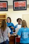 08/227/14 - Resident Advisors assist students with paperwork outside the Fred DeLay Gymnasium on move-in day.