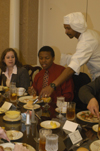 Chef Van serves lunch to Ray Jones and Ami Sherwood during the Etiquette Luncheon. - Photo by Lindsay Stavish