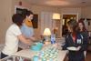 09/265/14 - Erin Slater, residence director for Heritage residence complex, and Kayla McKinney, residence director for the female quads, serve students during Res Life's Progressive Snacking event.