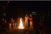 09/265/14 - Students gather around the fire pit at Grey residence complex to warm up during Res Life's Progressive Snacking event.