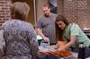 09/269/14 - Ken Litscher, director of residence life, and Brittany Winfree, residence life secretary, assist guests with registration for Family Weekend.