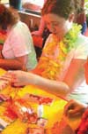 04/24/04 - Senior Donna Reed creates a Hawaiian name plate during the Hurt Luau.