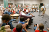 A large group of freshmen enjoyed the entertainment at Open Mic during FOCUS 2004. - Photo by Kristen Hiller