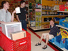 (left to right) Alvin Jeffery, David Kartzinel and Brian Burns take time to do a little shopping after a busy day of moving in. - Photo by Lindsay Stavish