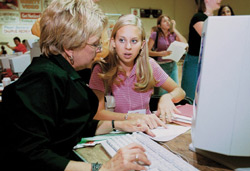 6/21/2002 - Sherry Tignor (left), co-director of the Center for New Students, assists Jill Martin, freshman from Lebanon, Tenn., with registration options during Freshman Pre-Registration. (ID: 246)