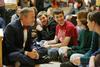 12/343/14 - Dub Oliver, president of the university, chats with students prior to Christmas with the Olivers.
