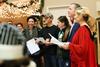 12/343/14 - Dub and Susie Oliver, president and first lady of the university, join students in McAfee Commons for Christmas carols and story time during Christmas with the Olivers.
