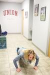 01/22/15 - Kaylene Portell, junior social work major, does 10 burpees as part of a challenge in res-life's Amazing Race game.