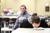 01/22/15 - Lauren Bone, junior psychology major, tries to find two pieces of gum in a whipped cream pie without using her hands. This challenge was part of Union's The Amazing Race event organized by Residence Life.