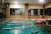 01/22/15 - Isaac Lisle, senior conservation biology major, dives into the pool during the last challenge of res-life's Amazing Race.