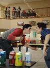 03/62/15 - Riley Pope, junior digital media studies major, and Eddie Echeverria, sophomore political science major, complete a station during Residence Life's Minute to Win it in the McAfee Commons.