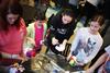 03/73/15 - Students and their siblings tie dye shirts on the Bowld Commons patio during Residence Life's Sibling Weekend.